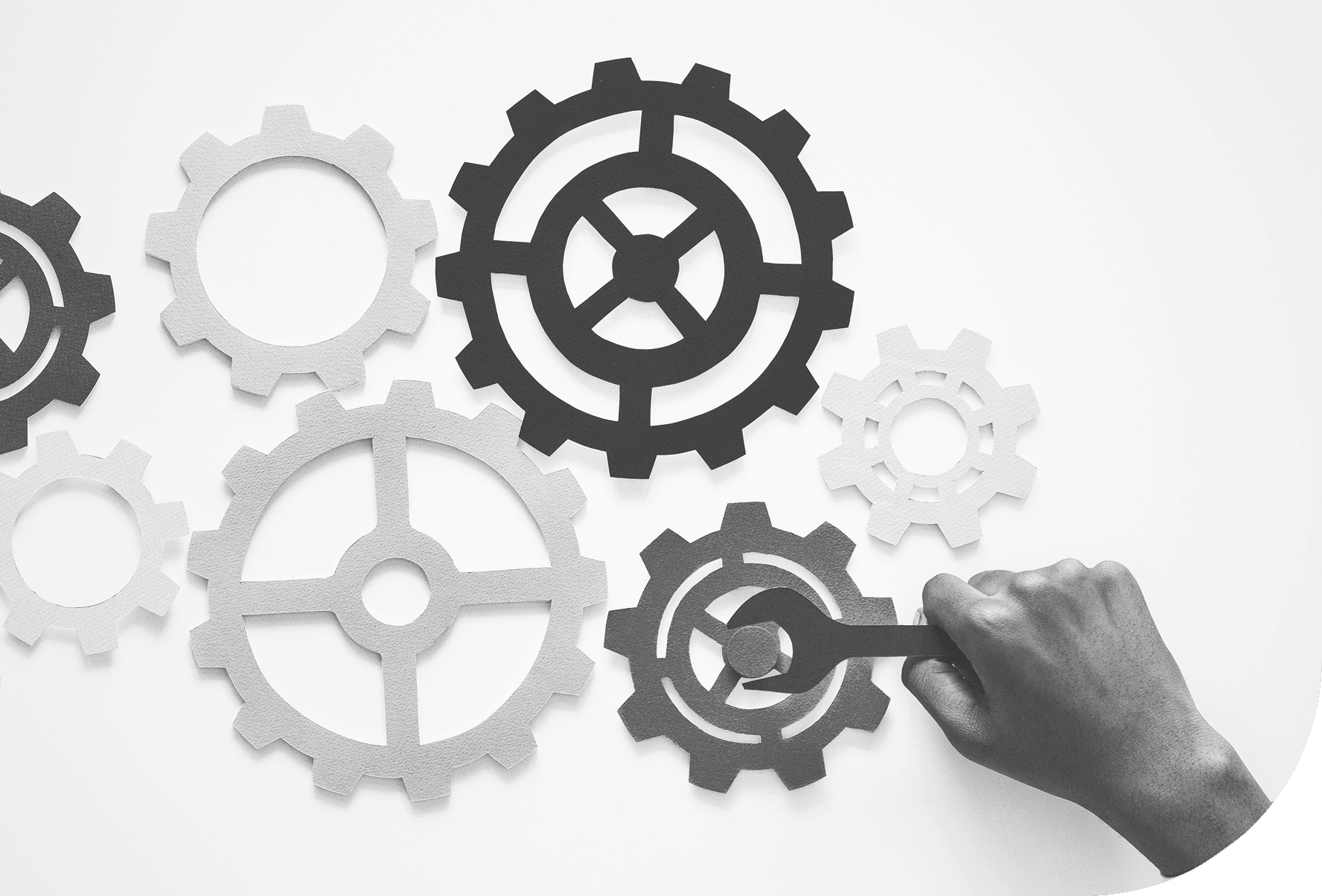 Paper gears representing the tools and processes behind our methodology