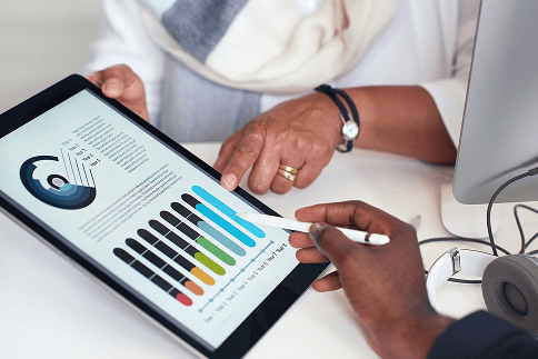 Colleagues reviewing ESG performance charts on a tablet